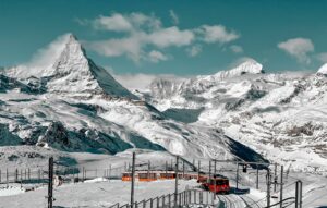 The iconic Matterhorn mountain peak in Zermatt Switzerland at sunrise.