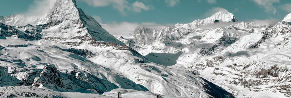 The iconic Matterhorn mountain peak in Zermatt Switzerland at sunrise.
